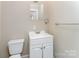 Compact bathroom features a clean vanity, toilet, and neutral decor at 730 Marble St, Charlotte, NC 28208