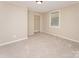 Neutral bedroom with carpeting, closet and a window offering natural light at 730 Marble St, Charlotte, NC 28208