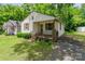 A quaint, single-story home with a small front porch and a well-maintained lawn at 730 Marble St, Charlotte, NC 28208