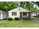 Charming single-story home featuring a cozy front porch and well-maintained landscaping at 730 Marble St, Charlotte, NC 28208
