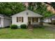Charming home with a covered front porch and manicured bushes at 730 Marble St, Charlotte, NC 28208
