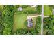 A home with a well-maintained lawn and gray roof is surrounded by green trees at 803 Freeman Rd, Concord, NC 28025
