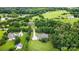 A beautiful home with a long driveway surrounded by lush trees and landscaping at 803 Freeman Rd, Concord, NC 28025