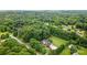A beautiful home surrounded by lush trees on a large lot at 803 Freeman Rd, Concord, NC 28025