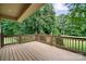 Spacious wooden back deck overlooks the lush backyard landscaping and mature trees at 803 Freeman Rd, Concord, NC 28025