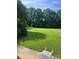 Expansive backyard with lush green grass and mature trees offering plenty of space at 803 Freeman Rd, Concord, NC 28025