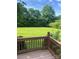 Backyard view from deck featuring spacious lawn and mature trees offering privacy at 803 Freeman Rd, Concord, NC 28025