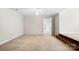 Spacious carpeted bedroom features a ceiling fan and doorway to another room at 803 Freeman Rd, Concord, NC 28025