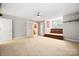 Spacious bonus room features a staircase platform, ceiling fan, and doorway at 803 Freeman Rd, Concord, NC 28025