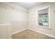 Walk-in closet with wire shelving and a window, offering ample storage space and natural light at 803 Freeman Rd, Concord, NC 28025