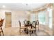 Cozy dining room with a glass-top table, decorative chairs, and natural light at 803 Freeman Rd, Concord, NC 28025