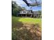 Charming two-story brick home with a welcoming covered porch and mature landscaping at 803 Freeman Rd, Concord, NC 28025