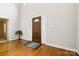 Inviting foyer with hardwood floors, high ceilings, and a beautiful front door with side windows at 803 Freeman Rd, Concord, NC 28025