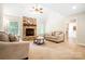 Cozy living room features a brick fireplace, neutral carpet, and comfortable seating at 803 Freeman Rd, Concord, NC 28025