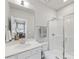 Clean bathroom featuring a glass-enclosed shower, modern vanity and a view into the home office at 933 E 36Th St, Charlotte, NC 28205