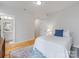 Serene bedroom with a queen-sized bed, hardwood floors, and an en-suite bathroom at 933 E 36Th St, Charlotte, NC 28205