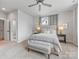 Comfortable bedroom with neutral colors, a ceiling fan, and plush carpeting at 933 E 36Th St, Charlotte, NC 28205