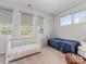 Cozy Bedroom with a crib, single bed, and natural light for a warm and inviting space at 933 E 36Th St, Charlotte, NC 28205