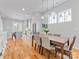 Bright dining room featuring a wooden table, stylish chairs, and modern pendant lighting at 933 E 36Th St, Charlotte, NC 28205