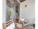 Cozy outdoor patio with chairs, with direct access to interior via large sliding glass doors at 933 E 36Th St, Charlotte, NC 28205