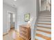 Inviting foyer with hardwood floors, staircase, and stylish decor creating a warm welcome at 933 E 36Th St, Charlotte, NC 28205
