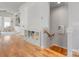 Inviting hallway with hardwood floors, built-in storage, and stairs leading to upper level at 933 E 36Th St, Charlotte, NC 28205