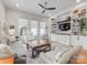Cozy living room featuring built-in shelving, hardwood floors, and comfortable seating at 933 E 36Th St, Charlotte, NC 28205
