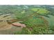 Aerial view of large parcel with road frontage and mixed cleared and wooded acreage at 10016 Morgan Mill Rd, Monroe, NC 28110