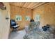 Plywood bedroom with three windows, office chair, camouflage print recliner and camo bedding with the label 'For Sale' at 10016 Morgan Mill Rd, Monroe, NC 28110