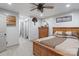 Cozy bedroom with neutral walls, a wooden bed frame, and ceiling fan at 10016 Morgan Mill Rd, Monroe, NC 28110