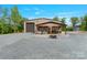 The property boasts a large outbuilding with workshop, and covered entertainment area at 10016 Morgan Mill Rd, Monroe, NC 28110