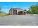The property boasts a large outbuilding with workshop, and covered entertainment area at 10016 Morgan Mill Rd, Monroe, NC 28110