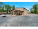 The property boasts a large outbuilding with workshop, and covered entertainment area at 10016 Morgan Mill Rd, Monroe, NC 28110