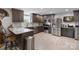 Stylish kitchen with stainless steel appliances, marble countertops, and a convenient breakfast bar at 10016 Morgan Mill Rd, Monroe, NC 28110