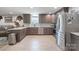 Well-equipped kitchen featuring granite countertops, stainless steel appliances, and ample cabinet space at 10016 Morgan Mill Rd, Monroe, NC 28110