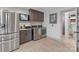 Functional laundry area with stainless steel appliances, stylish cabinetry, and extra storage space at 10016 Morgan Mill Rd, Monroe, NC 28110