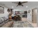 Inviting living room with a cozy sofa and a convenient kitchen area, perfect for relaxing at 10016 Morgan Mill Rd, Monroe, NC 28110