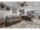 Comfortable living room seamlessly connects to a modern kitchen with an island and stainless steel appliances at 10016 Morgan Mill Rd, Monroe, NC 28110