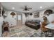Relaxing living room featuring a comfortable sofa, rustic decor, and a cozy atmosphere at 10016 Morgan Mill Rd, Monroe, NC 28110