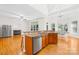Bright, airy kitchen with granite counters, stainless appliances, open layout to fireplace and dining nook at 10024 Hazelview Dr, Charlotte, NC 28277