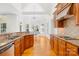 Open kitchen features granite countertops, stainless steel appliances, and hardwood floors with great natural light at 10024 Hazelview Dr, Charlotte, NC 28277