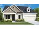 Charming single Gathering home displaying well-manicured landscaping and a neutral color palette at 1011 Idyllic Ln, Waxhaw, NC 28173