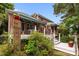 Brick home featuring a multi-level deck perfect for outdoor relaxation and entertaining with lovely flowers at 10317 Clubhouse View Ln, Mint Hill, NC 28227