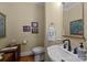 Half bathroom featuring a stylish vanity, and decorative wall art at 10317 Clubhouse View Ln, Mint Hill, NC 28227