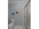 Bathroom featuring a toilet and a glass shower at 10317 Clubhouse View Ln, Mint Hill, NC 28227