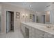 Bathroom featuring double sinks, white cabinetry, tile flooring, and a large mirror at 10317 Clubhouse View Ln, Mint Hill, NC 28227