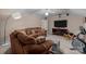Cozy bonus room with neutral tones, ceiling fan, exercise equipment, and plush seating at 10317 Clubhouse View Ln, Mint Hill, NC 28227