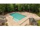 Aerial view of a sparkling community pool featuring ample seating and a splash area, great for leisure at 10317 Clubhouse View Ln, Mint Hill, NC 28227