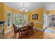 Charming dining room with a table, chairs, chandelier and bright windows at 10317 Clubhouse View Ln, Mint Hill, NC 28227