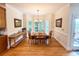 Formal dining area with hardwood floors, bay windows, and elegant lighting for a cozy atmosphere at 10317 Clubhouse View Ln, Mint Hill, NC 28227